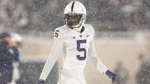 Football_ Player_in_ Snow_ Game Wallpaper