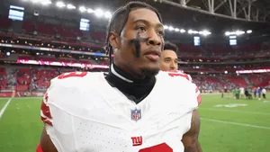 Football Player Isaiah Simmons On Field Wallpaper