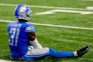 Football Player Kerby Joseph Restingon Field Wallpaper