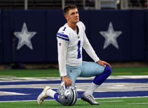 Football Player Kneeling Dallas Stadium Wallpaper