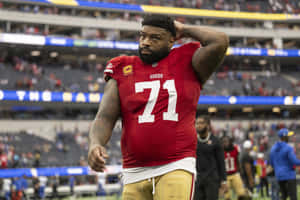 Football_ Player_ Number_71_ Walking_ Off_ Field Wallpaper