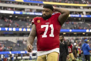 Football_ Player_ Number_71_ Walking_ Off_ Field Wallpaper