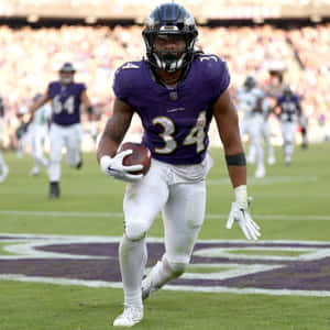 Football Player Number34 Action Shot Wallpaper