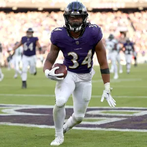 Football Player Number34 Action Shot Wallpaper