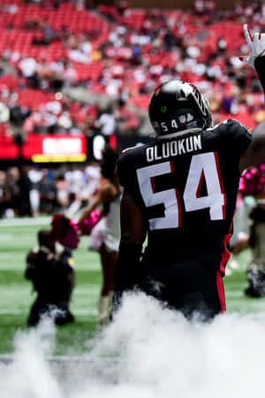 Football Player Oluokun54 Entering Field Wallpaper