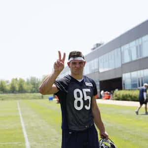 Football Player Peace Sign Practice Field Wallpaper