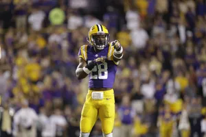 Football Player Pointing On Field Wallpaper