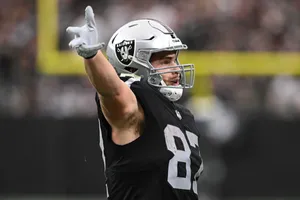 Football Player Pointing On Field Wallpaper