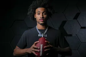 Football Player Portraitwith Ball Wallpaper