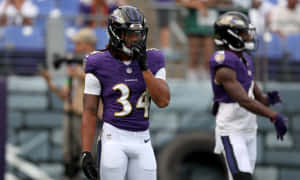 Football Player Pre Game Concentration Wallpaper