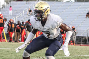 Football Player Ready For Action Wallpaper