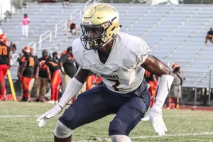 Football Player Ready For Action Wallpaper