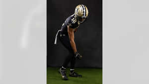 Football Player Ready For Action Wallpaper