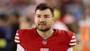 Football Player Red Jersey Portrait Wallpaper