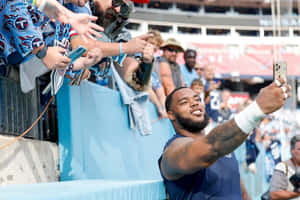 Football Player Selfie With Fans Wallpaper