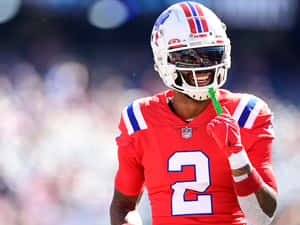 Football Player Smiling During Game Wallpaper