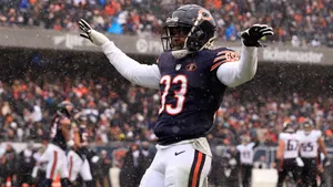 Football Player Snowy Game Celebration Wallpaper