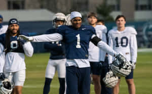 Football Player Stretching During Practice.jpg Wallpaper