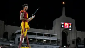 Football Player Sword Celebration Stadium Night Wallpaper