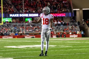 Football Player Thumbs Up On Field.jpg Wallpaper