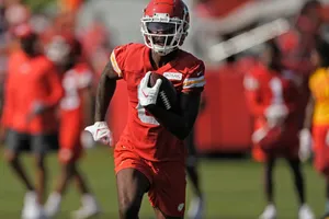 Football Player Training Catch Wallpaper