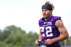 Football Player Training Outdoors Wallpaper