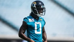 Football Player Training Outdoors Jaguars Uniform Wallpaper