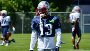 Football Player Training Session Outdoors Wallpaper