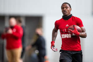 Football Player Training Session Wallpaper