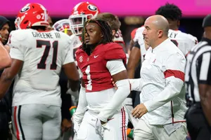 Football Player Walkingwith Coach Wallpaper