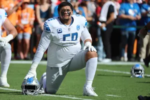 Football Player Warming Up Field Wallpaper