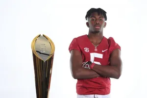 Football Player With Championship Trophy Wallpaper