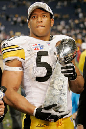 Football Player With Super Bowl Trophy Wallpaper