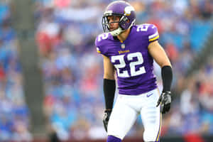 Football Playerin Purple Jersey Number22 Wallpaper