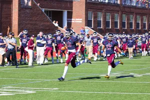 Football Players Celebrating Victoryon Field.jpg Wallpaper