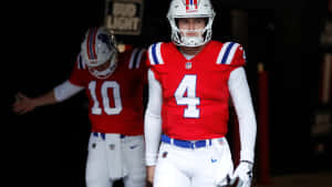 Football Players Entering Stadium Wallpaper