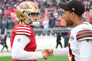 Football Players Handshake Game Day Wallpaper