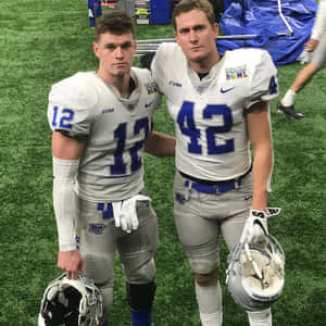 Football Players Post Game Portrait Wallpaper