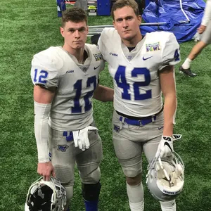 Football Players Post Game Portrait Wallpaper