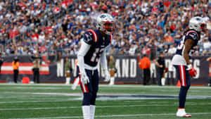 Football Players Readyfor Action Wallpaper