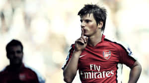 Football Players Running For Success Wallpaper