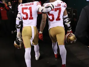 Football Players Walking Off Field Wallpaper