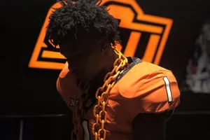 Football Playerwith Orange Chain Wallpaper