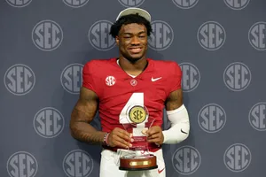 Football Playerwith S E C Trophy Wallpaper