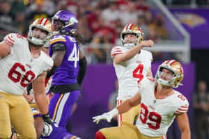 Football Quarterback Action Shot Wallpaper