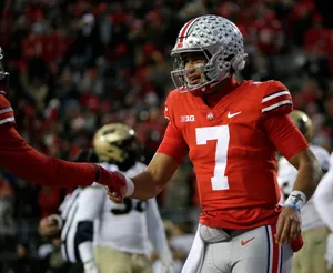 Football Quarterback Fist Bump Wallpaper