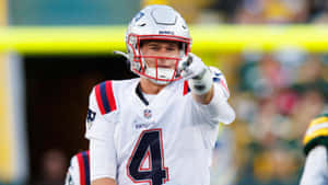 Football Quarterback Pointing Action Wallpaper