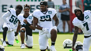 Football Training Session Eagles Players Warming Up Wallpaper