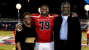 Footballer Ikem Ekwonu With His Parents Wallpaper