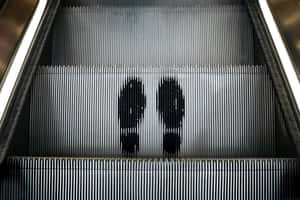 Footprints On Automatic Escalator Wallpaper